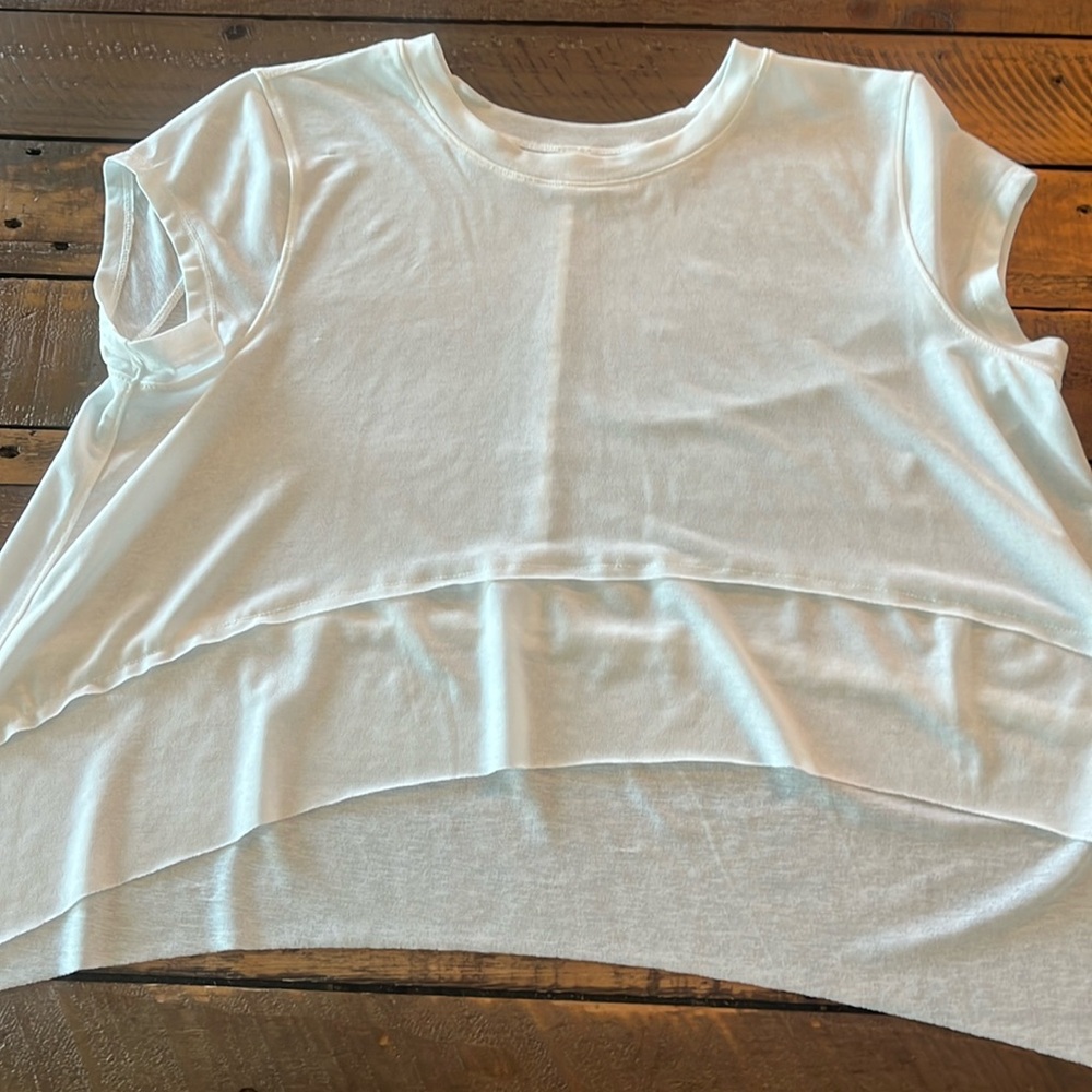 Super cute white cropped T-shirt by FP Movement like new